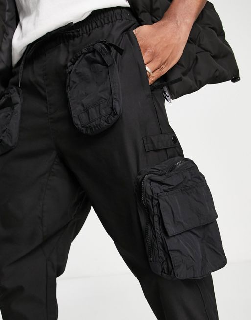 Bershka utility cargo pants with pockets in black