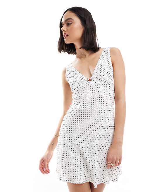Bershka - Vestito corto a pois bianco e nero con laccio sul retro