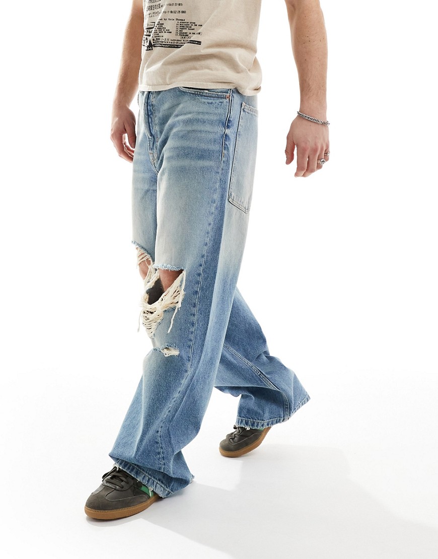 washed distressed denim baggy jeans in blue