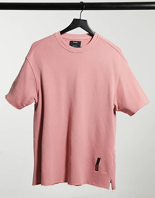 Bershka washed t-shirt with raw edge in pink