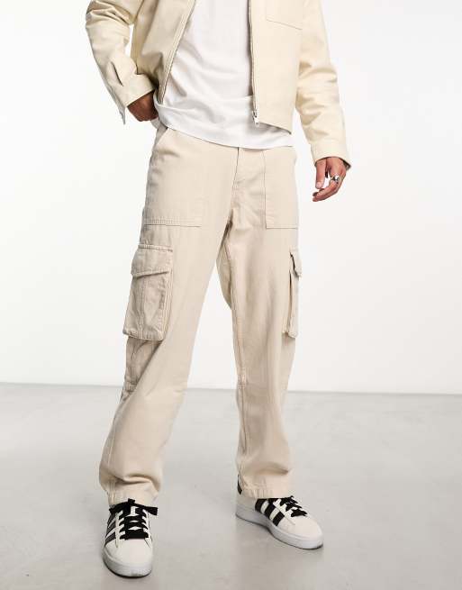 Bershka Petite pocket detail slim leg cargo pants in light beige