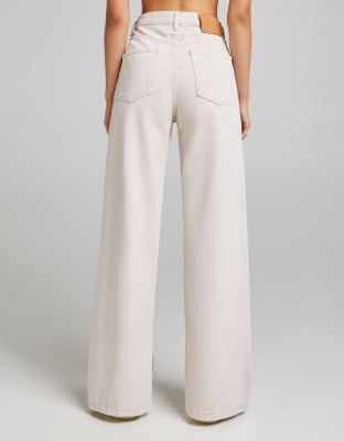 Bershka wide leg jean with knee rip in beige | ASOS