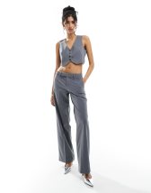 Bershka Petite folded waistband flared pants in black