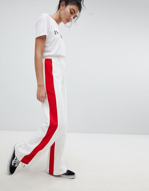 White trousers store red stripe