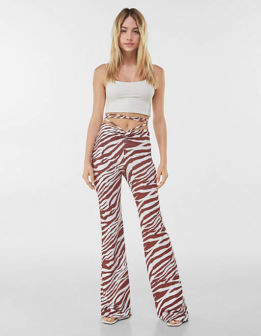 Bershka wide leg zebra print trouser with strap detail in brown