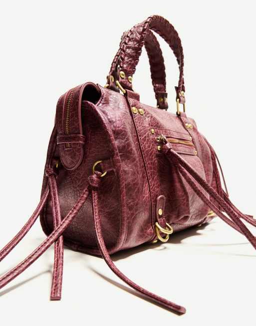 Bershka worn effect bowling bag with straps in burgundy | ASOS