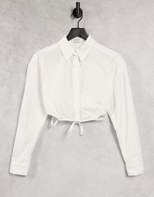 Bershka wrap around cropped poplin shirt in white