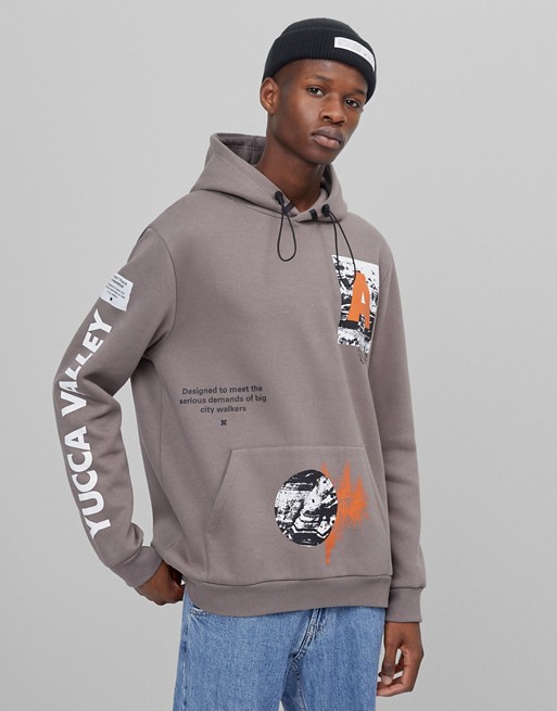 Bershka yucca valley placement print hoodie in grey