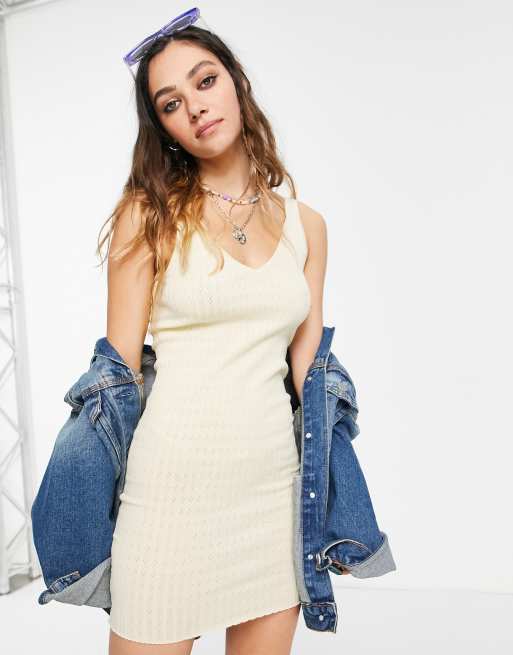 Bershka – Żółta sukienka dzianinowa z dekoltem w szpic