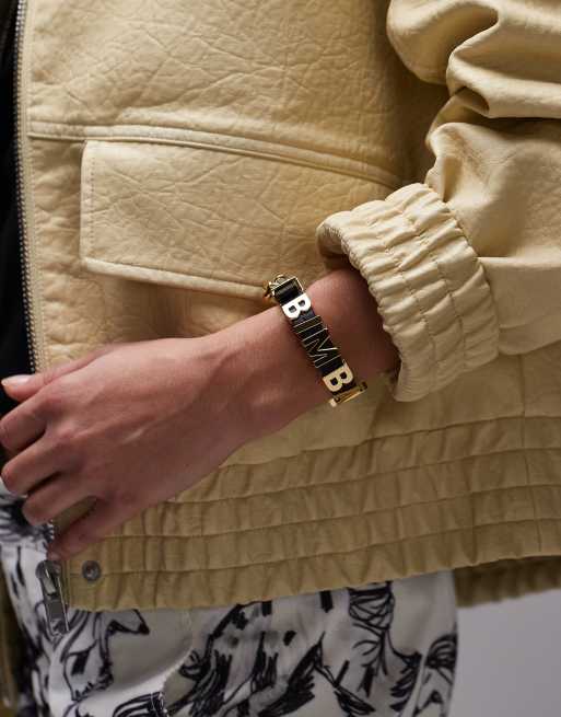 BIMBA Y LOLA - Bracciale nero e color oro con logo