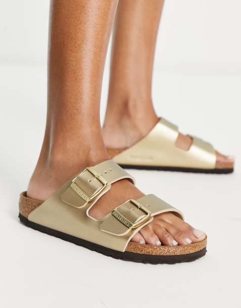 Birkenstock – Arizona – Flache Birko-Flor-Sandalen in Goldoptik - view 1