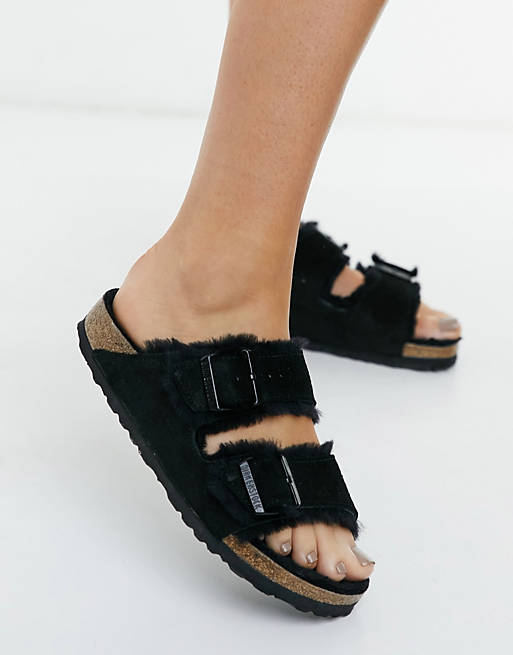 Birkenstock Arizona flat sandals in black with fur lining