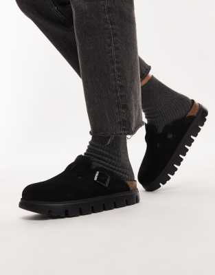 Birkenstock - Boston - Klobige Clogs in Schwarz mit Lammfellfutter
