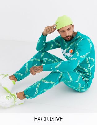 фото Бирюзовые джоггеры со сплошным принтом логотипа ellesse tomi эксклюзивно для asos-зеленый