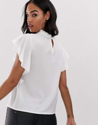 blusa blanca volantes