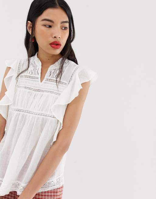 Blusa blanca con detalle de bordado de Mango