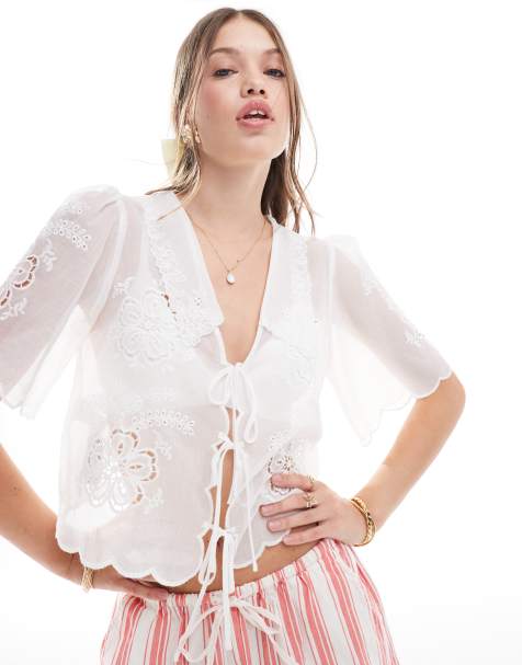 Blusa blanca con lazada delantera y diseño bordado de Mango - view 1
