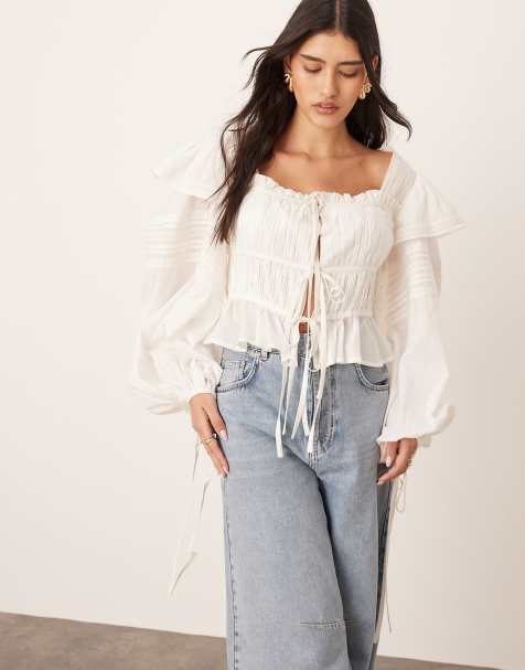 Blusa blanca de voile de algodón con lazada delantera y ribete de encaje de ARRANGE - view 1