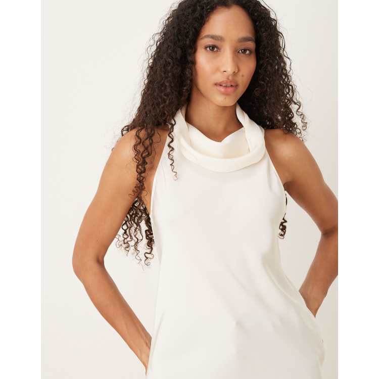 Blusa blanca sin mangas con cuello alto de Mango ASOS