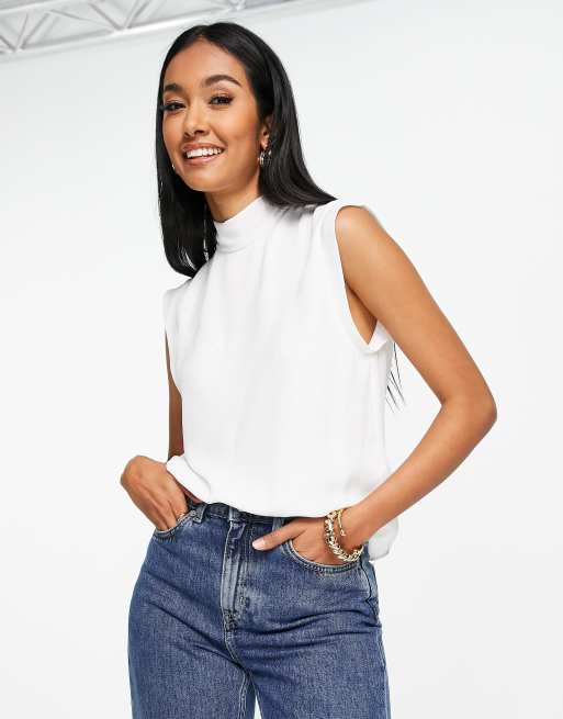 Blusa blanca sin con cuello alto y lazada en la espalda ASOS DESIGN | ASOS