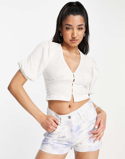 Blusa de tarde blanca con mangas abullonadas y botones en la parte delantera de Monki