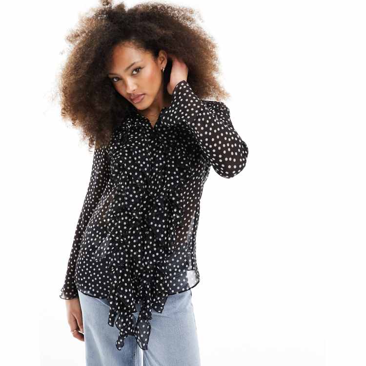 Blusa negra con estampado de lunares y volantes delanteros de Mango ClassicfuncenterShops