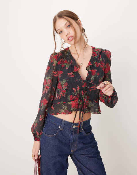 Blusa negra con estampado floral y volante Lotus de Nobody's Child - view 1