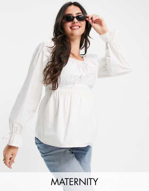 Blusa premamá blanca amplia con sobrefalda de Pieces