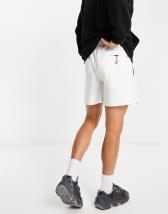 GUESS Originals washed nylon shorts in peach | ASOS