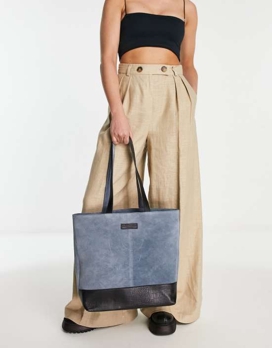 https://images.asos-media.com/products/bolongaro-trevor-vivienne-large-tote-bag-in-gray-blue/201348524-2?$n_550w$&wid=550&fit=constrain