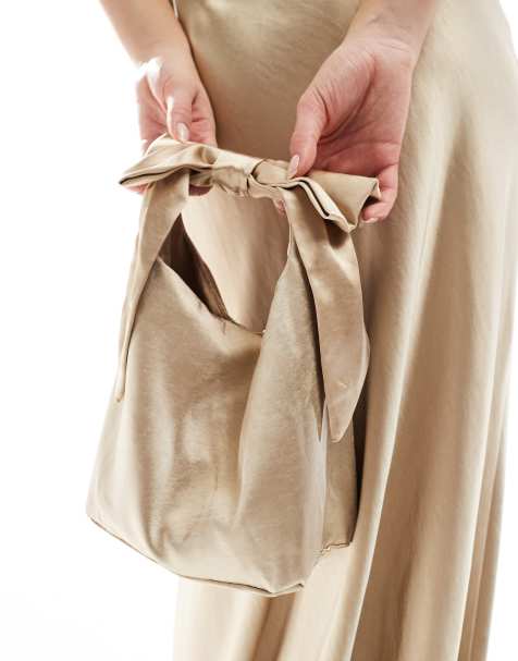 Bolso de dama de honor dorado con detalle de lazo de satén de Six Stories - view 1