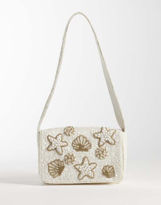Bolso de hombro color crema con adornos de concha de Accessorize
