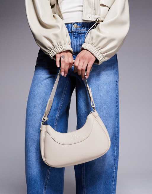 Bolso de mano color crema redondeado con logo de Armani Exchange