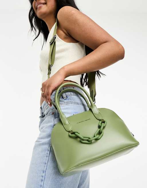 Bolso de mano grande verde oliva con dise o curvado y detalle de