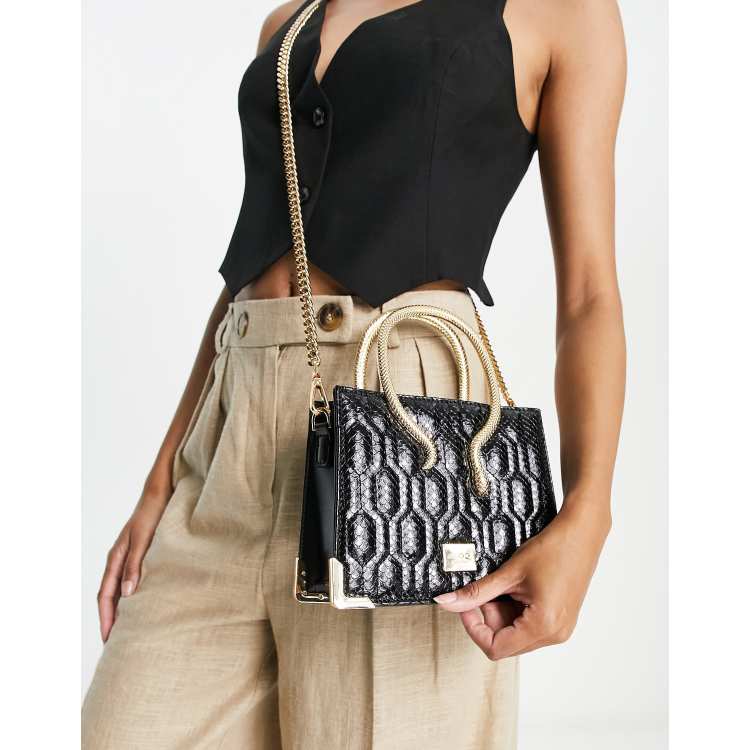 Bolso de mano negro con motivo de serpiente premium Allure de ALDO