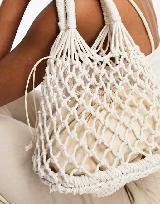 Bolso de mano peque o color crema de cordones de Madein. ASOS