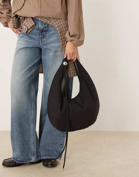 Bolso negro de nailon con diseño redondeado y correa de cordón de Calvin Klein - view 1