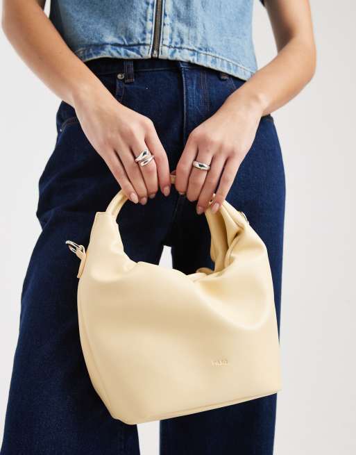 Bolso pequeño amarillo crema con asa superior, cordón ajustable y bandolera de PASQ, 2 de 4