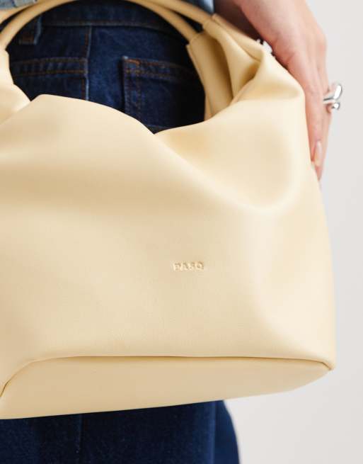 Bolso pequeño amarillo crema con asa superior, cordón ajustable y bandolera de PASQ, 4 de 4