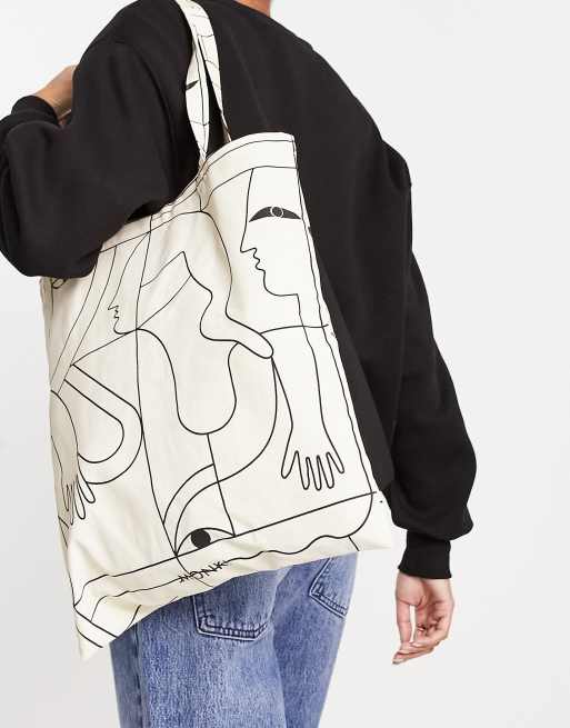 Bolso tote de color crema con estampado People de Monki