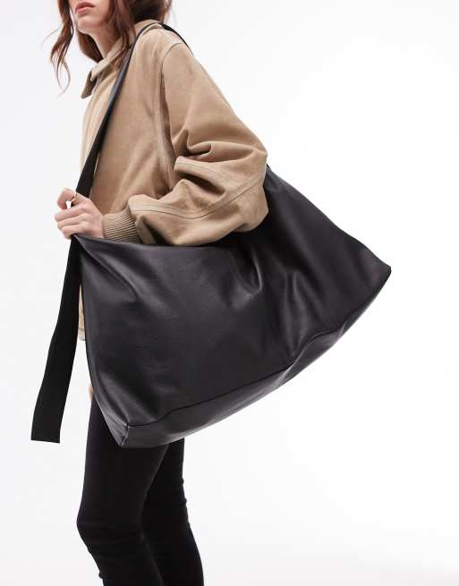 Bolso tote negro de cuero con detalle de correa Leon de Topshop