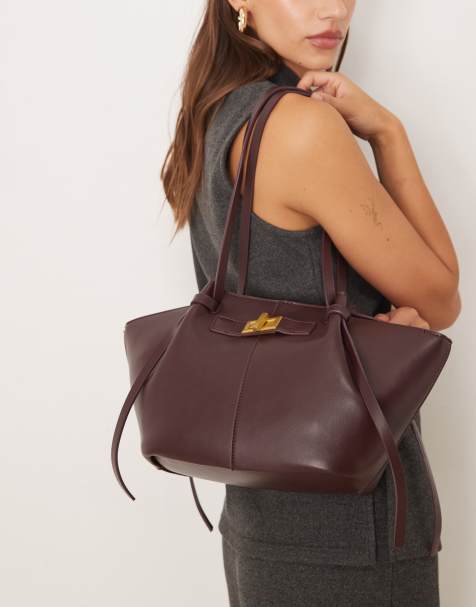 Bolso tote pequeño burdeos oscuro con asas y detalle tipo clutch de cuero sintético de Gina Tricot - view 1