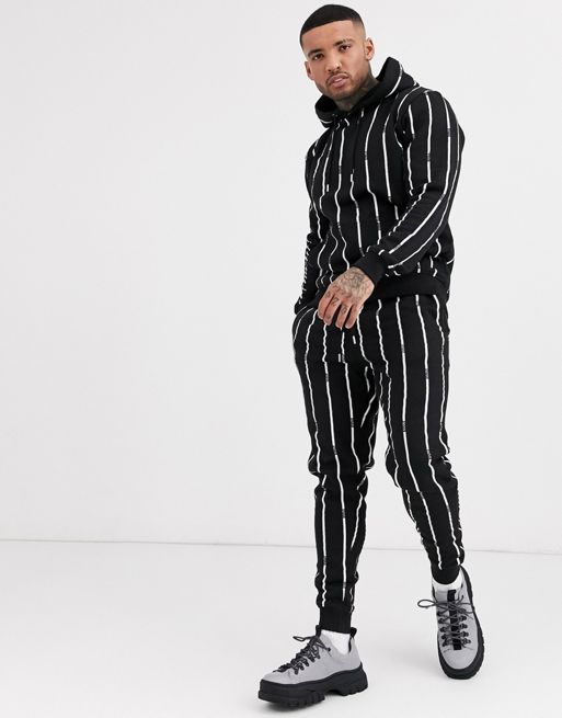 boohooMAN all over man stripe tracksuit in black | ASOS