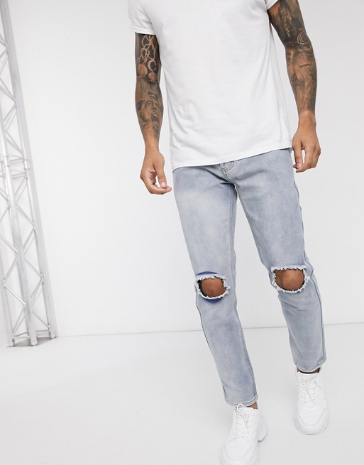 boohooMAN busted knees slim fit jeans in light blue wash