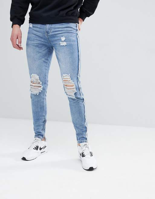 boohooMAN – Enge, ungesäumte Jeans mit Reißverschlusssaum in verwaschenem Blau
