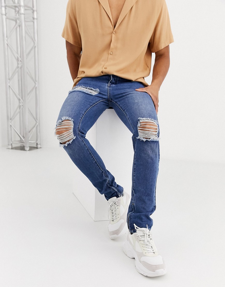 BoohooMAN - Jeans skinny lavaggio blu medio con strappi al ginocchio