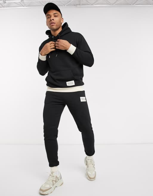 boohooMAN Man print hooded tracksuit with contrast rib in black ASOS