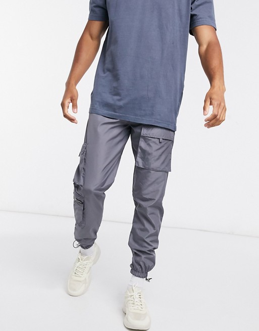 boohooMAN nylon multi pocket cargo trousers in charcoal grey
