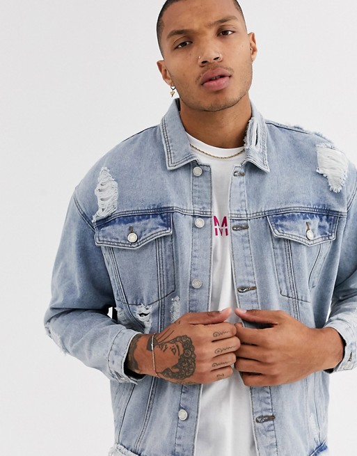 boohooMAN oversized denim jacket with heavy distressing in light blue wash