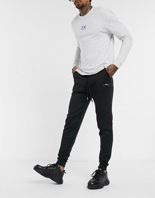 BoohooMAN signature embroidered skinny joggers in black